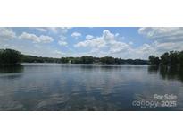Scenic lake view featuring blue skies and calm water, perfect for relaxing waterfront living at 4485 River Oaks Rd, Lake Wylie, SC 29710