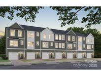 Modern townhome exterior featuring a gray and white facade, garages, and well-manicured landscaping at 542 Beatties Ford Rd, Charlotte, NC 28216