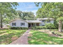 Charming single Gathering home with mature trees, sidewalk and nice front yard at 3311 Camden Rd, Marshville, NC 28103