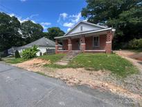 Charming red brick home with a cozy front porch and inviting curb appeal at 119 Hemlock Ave, Kannapolis, NC 28081