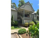 Inviting condo featuring a covered entrance, well-maintained landscaping, and a blend of natural light at 1590 Springpoint Rd # B, Rock Hill, SC 29732