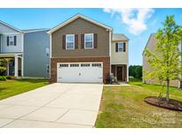 Charming two-story home with a two-car garage and a well-maintained front yard at 2282 Redstone Dr, York, SC 29745