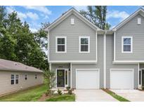 Charming townhome with neutral siding, well-manicured lawn, and attached garage at 2818 Old Steele Creek Rd, Charlotte, NC 28208