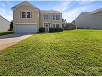 Charming two-story home with well-maintained lawn and attached garage, perfect for a Gathering at 1958 Leesburg Dr, Clover, SC 29710