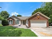 Charming single-story home with a brick facade and a well-manicured front lawn at 4507 Mackinac St, Charlotte, NC 28269