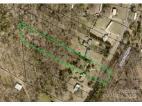 Aerial view of the property with a green boundary line, highlighting land and proximity to Grassy Creek Rd at 4905 Grassy Creek Rd, Denver, NC 28037