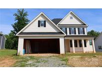 New construction home with white siding, black shutters, and an open garage ready for customization at 114 Still Creek Dr, Mooresville, NC 28115