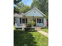 Charming single-story home featuring a classic front porch and well-maintained lawn at 124 Powder Sw St, Concord, NC 28025