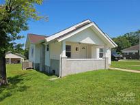 Charming bungalow with a covered front porch and well-maintained lawn at 1704 16Th Ne St, Hickory, NC 28601