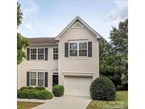 Charming two-story home with a well-maintained lawn and attached garage at 2150 Winthrop Chase Dr, Charlotte, NC 28212