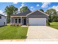 Charming single-story home featuring a two-car garage and a well-manicured front yard at 455 Contentment Ct # 18, Kannapolis, NC 28081