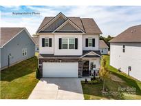 Charming two-story home with a two-car garage and a welcoming front porch, set in a well-maintained community at 1248 Langston Ln, Salisbury, NC 28144