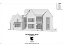 Two-story brick home featuring multiple windows and a covered front porch with an arched entrance at 1418 Samuel Spencer Pkwy, Davidson, NC 28036