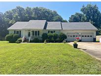 Charming single-story home with a well-manicured lawn and an attached two-car garage at 2174 Eastview Rd, Rock Hill, SC 29732