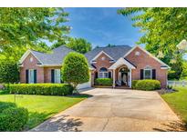 Charming brick home with manicured landscaping and a well-maintained lawn on a sunny day at 2289 Veery Ln, Rock Hill, SC 29732