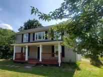 Charming two-story home with a welcoming front porch and well-maintained lawn at 315 Second St, Stanley, NC 28164