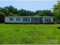Charming single-Gathering home features a covered porch and well-maintained lawn at 33343 Old Salisbury Rd, Albemarle, NC 28001