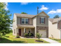 Charming two-story home with stone accents and a well-maintained front yard at 4732 Gibbons Link Rd, Charlotte, NC 28269