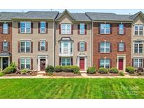 Charming townhomes with landscaped front yards and classic architectural details at 7612 Turley Ridge Ln, Charlotte, NC 28273