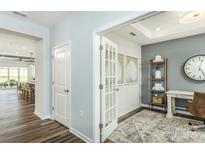 Bright home office with open doorway, french doors, wood floors, gray accent wall and white trim at 1022 Kinship Dr # 118, Lancaster, SC 29720