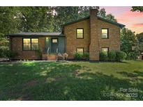 Charming brick home with a well-maintained lawn and inviting front entrance at 1510 Sansberry Rd, Charlotte, NC 28262