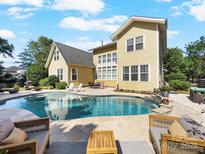Inviting backyard pool with ample seating, perfect for entertaining and relaxing outdoors at 163 Shoreline Pkwy, Tega Cay, SC 29708