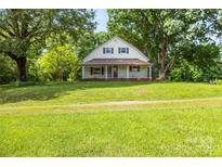 Charming two-story home with a welcoming front porch and a large, well-maintained front yard at 2028 Old Latter Rd, Newton, NC 28658