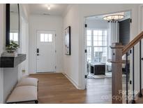 Welcoming entryway with hardwood floors and an open view to the living area at 2195 Millennium Dr # 20, Lancaster, SC 29720