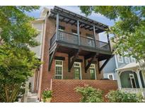 Stunning brick exterior featuring a charming balcony and well-maintained landscaping at 739 Terrace Park, Rock Hill, SC 29730