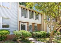 Traditional multi-level home showcasing manicured landscaping and a classic front entrance at 8266 Knights Bridge Rd, Charlotte, NC 28210