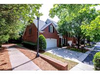 Charming brick home with well-manicured landscaping and a two-car garage at 7554 Bluestar Ln, Charlotte, NC 28226
