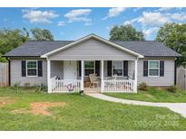 Charming single-story home with a cozy front porch and well-maintained landscaping at 810 4Th St, Kings Mountain, NC 28086