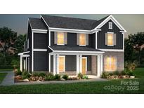 Charming two-story home with a brick-accented front and a welcoming covered porch at 9520 Coast Laurel Nw Ave, Concord, NC 28027