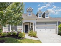 Charming home featuring a two-car garage and beautifully landscaped front yard at 101 Daybreak Ln, Belmont, NC 28012