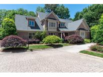Charming brick home with well-manicured landscaping and a welcoming front yard at 18534 Carnegie Overlook Blvd # 110, Davidson, NC 28036