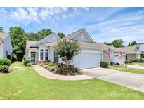 Charming single-story home with a well-manicured lawn and a two-car garage, displaying a neat exterior at 3079 Azalea Dr, Fort Mill, SC 29707