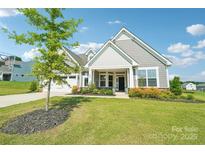 Charming single-Gathering home with manicured lawn, two-car garage, covered entrance, and beautiful landscaping at 507 Yucatan Dr # 71, Waxhaw, NC 28173