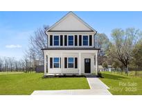 Charming two-story home with a covered porch and well-manicured front yard at 925 Marys Grove Rd, Cherryville, NC 28021
