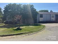 Charming building with manicured lawn, mature trees, and convenient parking at 11123 Harrowfield Rd, Charlotte, NC 28226