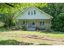 Charming cottage-style home with a welcoming front porch and a well-maintained front yard at 1173 Cat Square Rd, Vale, NC 28168