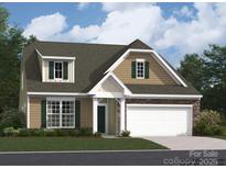 Charming two-story home boasts a stone-accented facade, attached two-car garage, and beautiful curb appeal at 6388 Fairfax Ct, Maiden, NC 28650