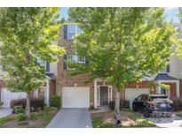 Charming brick townhome with a one car garage and well maintained landscaping at 9720 Walkers Glen Nw Dr, Concord, NC 28027