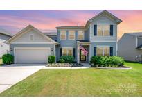 Charming two-story home with well-manicured lawn and inviting curb appeal in a desirable neighborhood at 5079 Nighthawk Dr, Fort Mill, SC 29707