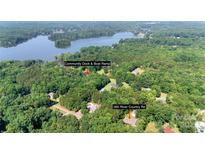 Stunning aerial view of 260 River Country Rd with lake access and community boat ramp at 260 River Country Rd, Salisbury, NC 28146
