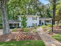 Charming two-story home with a lush, landscaped front yard and inviting walkway at 4618 Emory Ln, Charlotte, NC 28211