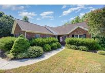 Charming brick home with a well-maintained landscaped front yard and inviting walkway at 610 Mountain Pl, Albemarle, NC 28001