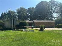 Ranch style home featuring stacked stone and attached carport at 195 Keats Rd, Mooresville, NC 28117