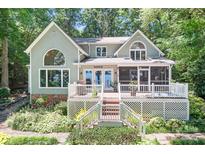 Charming two-story home with a large porch overlooking a lush landscape, ideal for outdoor living at 2704 Apache Trl, Denver, NC 28037