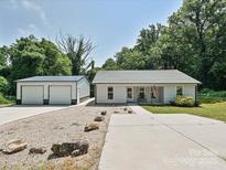 Charming single-story home with a detached garage and well-maintained front yard at 285 Hannah Ave, Salisbury, NC 28147