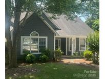 Charming single-story home with a well-maintained lawn and inviting front porch at 328 Glenridge Ct, Indian Trail, NC 28079